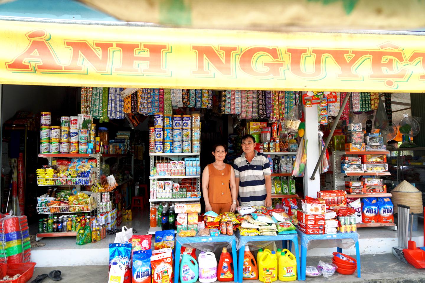 Man and woman in their shop in Vietnam