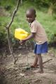 child using a tippy tap