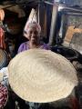 Woman producing injera